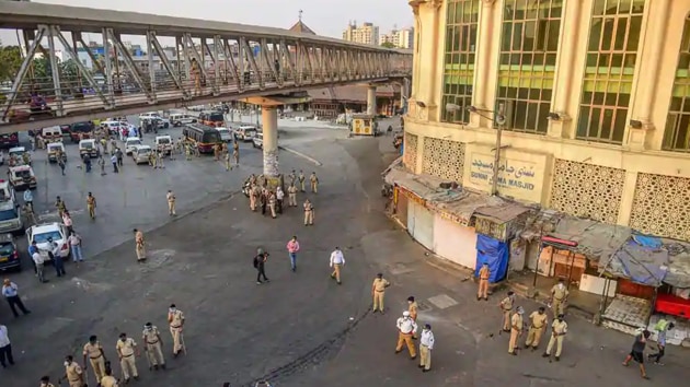 Police personnel stand guard after a crowd of migrant workers demanding transport arrangements for them to go back to their native places, was dispersed from the Bandra station on Tuesday. (PTI photo) Police personnel stand guard after a crowd of migrant workers demanding transport arrangements for them to go back to their native places, was dispersed from the Bandra station on Tuesday. (PTI photo)