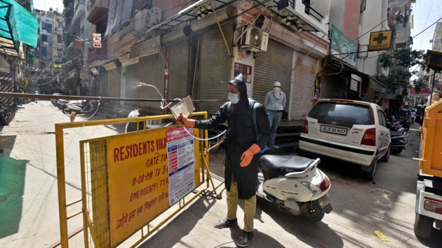 A municipal worker chemically disinfects a house in south Delhi’s Khirki Extension, one of the hotspot areas sealed to curb the spread of coronavirus. (Sanjeev Verma/HT PHOTO) A municipal worker chemically disinfects a house in south Delhi’s Khirki Extension, one of the hotspot areas sealed to curb the spread of coronavirus. (Sanjeev Verma/HT PHOTO)