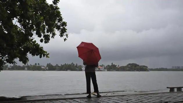 A man stands by the sea as it drizzles in Kochi in Kerala on May 28, 2018.(AP File Photo) A man stands by the sea as it drizzles in Kochi in Kerala on May 28, 2018.(AP File Photo)
