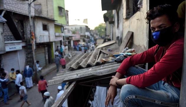 Small industries’ workers sitt outside their homes in the evening at Dharavi in Mumbai. (Satish Bate/HT Photo) Small industries’ workers sitt outside their homes in the evening at Dharavi in Mumbai. (Satish Bate/HT Photo)