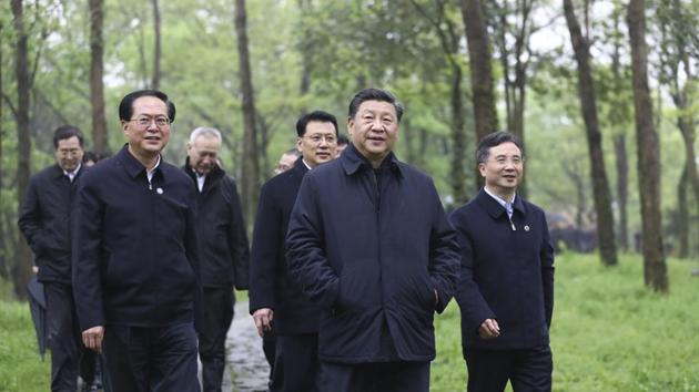 Chinese President Xi Jinping, second right, visits the Xixi National Wetland Park during an inspection in Hangzhou, in eastern China's Zhejiang Province, on Tuesday, March 31, 2020. (AP) Chinese President Xi Jinping, second right, visits the Xixi National Wetland Park during an inspection in Hangzhou, in eastern China's Zhejiang Province, on Tuesday, March 31, 2020. (AP)