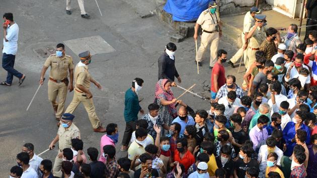 Some of the workers at the train station in Mumbai on Tuesday were lathi-charged by police, who were caught by surprise at the sudden gathering. (Zoya Lobo / HT Photo)