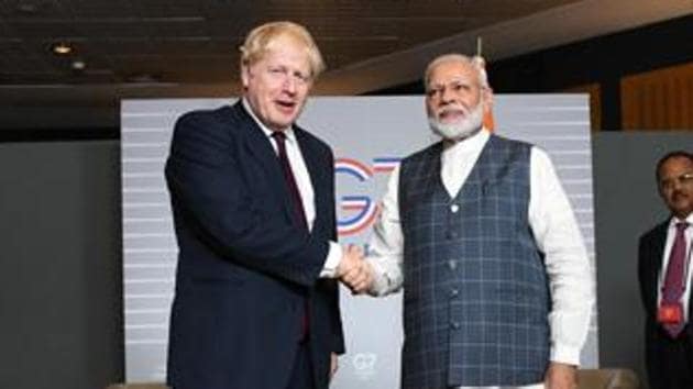 Britain's Prime Minister Boris Johnson with Prime Minister Narendra Modi at a bilateral meeting during the G7 summit in France in August, 2019.(Reuters Photo)