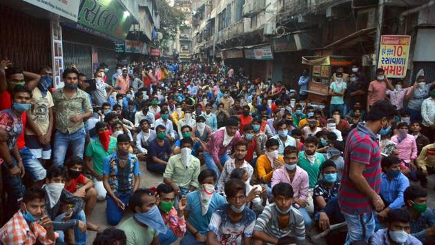 A similar protest was seen in Surat in Gujarat on Tuesday, when hundreds of migrant workers sat on a street asking to be allowed to go back home. (AFP)