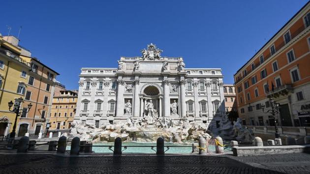 A view taken on April 11, 2020 shows a deserted Piazza di Trevi and the Trevi fountain in central Rome during the lockdown aimed at curbing the spread of the Covid-19 infection (AFP) A view taken on April 11, 2020 shows a deserted Piazza di Trevi and the Trevi fountain in central Rome during the lockdown aimed at curbing the spread of the Covid-19 infection (AFP)