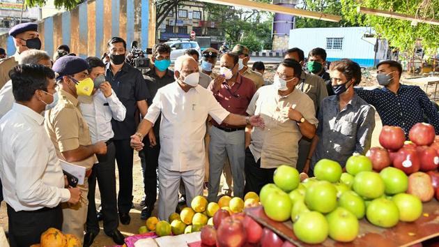 Karnataka Chief Minister BS Yediyurappa interacts with fruit and vegetable vendors during a nationwide lockdown in the wake of coronavirus pandemic. (PTI) Karnataka Chief Minister BS Yediyurappa interacts with fruit and vegetable vendors during a nationwide lockdown in the wake of coronavirus pandemic. (PTI)