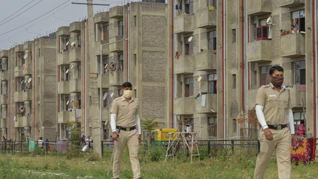 Police personnel take a round of a park to check and stop morning walkers during a nationwide lockdown in the wake of coronavirus pandemic, at EVS Colony of Village Dhanas in Chandigarh. (PTI) Police personnel take a round of a park to check and stop morning walkers during a nationwide lockdown in the wake of coronavirus pandemic, at EVS Colony of Village Dhanas in Chandigarh. (PTI)