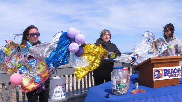 In this membbers of the Clean Ocean Action environmental group unfurl a banner made of balloons they picked up from the beach. (AP) In this membbers of the Clean Ocean Action environmental group unfurl a banner made of balloons they picked up from the beach. (AP)