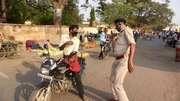 A police personnel hits a person out breaking restrictions at Danapur during lockdown against coronavirus in Patna, Bihar, India on Tuesday April 14, 2020.(Photo: Santosh Kumar / Hindustan Times) A police personnel hits a person out breaking restrictions at Danapur during lockdown against coronavirus in Patna, Bihar, India on Tuesday April 14, 2020.(Photo: Santosh Kumar / Hindustan Times)