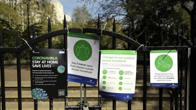 Coronavirus guideline signs are displayed by an entrance to Victoria Embankment Gardens in London, during the lockdown to try and stop the spread of coronavirus. (AP) Coronavirus guideline signs are displayed by an entrance to Victoria Embankment Gardens in London, during the lockdown to try and stop the spread of coronavirus. (AP)