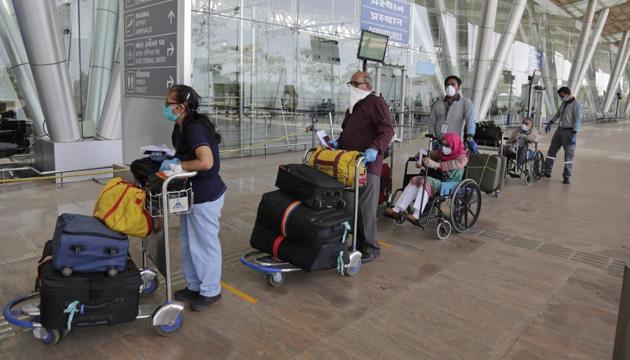 British nationals wait to enter the airport to board a special chartered flight to London during lockdown to control the spread of the new coronavirus in Ahmedabad, India, Monday, April 13, 2020. (AP photo) British nationals wait to enter the airport to board a special chartered flight to London during lockdown to control the spread of the new coronavirus in Ahmedabad, India, Monday, April 13, 2020. (AP photo)