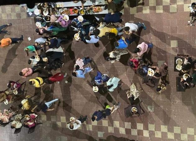 The aerial view of the video shows around 50 invitees breaching social distancing norms, mingling together and eating food served to them from stalls set up outside the apartment building located in a posh area of the city . The aerial view of the video shows around 50 invitees breaching social distancing norms, mingling together and eating food served to them from stalls set up outside the apartment building located in a posh area of the city .