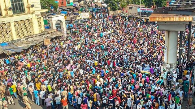 In one of the most glaring incidents of lockdown violations, hundreds of migrant workers gathered outside Bandra West Railway Station on Tuesday demanding transportation to their homes in different states.(PTI)