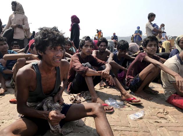 Rohingya refugees react after being rescued in Teknaf near Cox's Bazar, Bangladesh, Thursday, April 16, 2020. Bangladesh's coast guard has rescued 382 starving Rohingya refugees who had been drifting at sea for weeks after failing to reach Malaysia, officials said Thursday. AP/PTI(AP16-04-2020_000191B) (AP) Rohingya refugees react after being rescued in Teknaf near Cox's Bazar, Bangladesh, Thursday, April 16, 2020. Bangladesh's coast guard has rescued 382 starving Rohingya refugees who had been drifting at sea for weeks after failing to reach Malaysia, officials said Thursday. AP/PTI(AP16-04-2020_000191B) (AP)