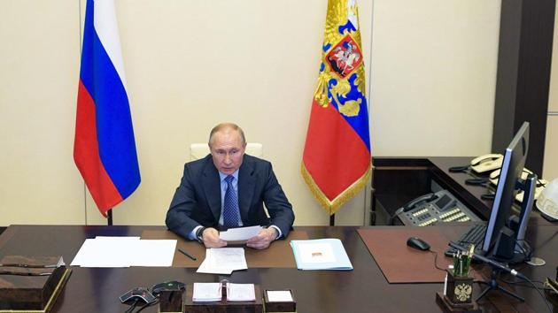 Russian President Vladimir Putin speaks during a video conference at the Novo-Ogaryovo residence outside Moscow. (AP) Russian President Vladimir Putin speaks during a video conference at the Novo-Ogaryovo residence outside Moscow. (AP)