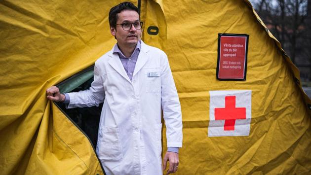 Near the building where Adami usually delivers her lectures, two yellow tents have been erected to test suspected COVID-19 cases, manned by doctors and nurses who duck in and out in protective clothing. Doctor Hilmar Gerber, operations manager of the primary health clinic, said the scheme’s graduates were proving “very helpful and a very good resource.” (Jonathan Nackstrand / AFP) Near the building where Adami usually delivers her lectures, two yellow tents have been erected to test suspected COVID-19 cases, manned by doctors and nurses who duck in and out in protective clothing. Doctor Hilmar Gerber, operations manager of the primary health clinic, said the scheme’s graduates were proving “very helpful and a very good resource.” (Jonathan Nackstrand / AFP)