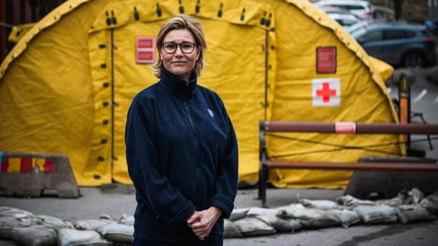 Leena Engblom, outside a tent for testing and receiving potential coronavirus COVID-19 patients. After a three-day crash course in communicable diseases, hygiene and treating patients and one day of practical training, Engblom, 48, now works as a medical assistant. She now does administrative tasks, helps clean and welcomes patients. (Jonathan Nackstrand / AFP) Leena Engblom, outside a tent for testing and receiving potential coronavirus COVID-19 patients. After a three-day crash course in communicable diseases, hygiene and treating patients and one day of practical training, Engblom, 48, now works as a medical assistant. She now does administrative tasks, helps clean and welcomes patients. (Jonathan Nackstrand / AFP)