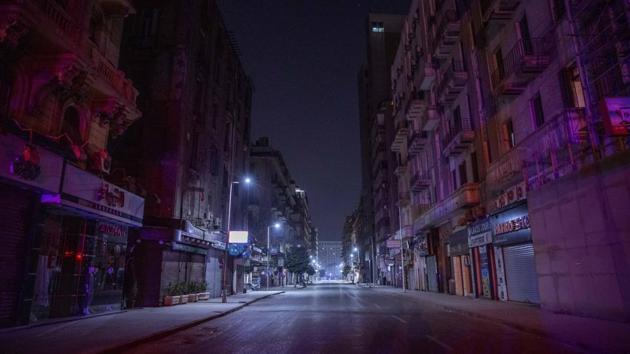 At night, though, the difference is stark in the capital’s crowded commercial downtown, where shops’ shutters are drawn and locked and the cacophony of the normally crowded streets is conspicuously absent. (Nariman El-Mofty / AP) At night, though, the difference is stark in the capital’s crowded commercial downtown, where shops’ shutters are drawn and locked and the cacophony of the normally crowded streets is conspicuously absent. (Nariman El-Mofty / AP)