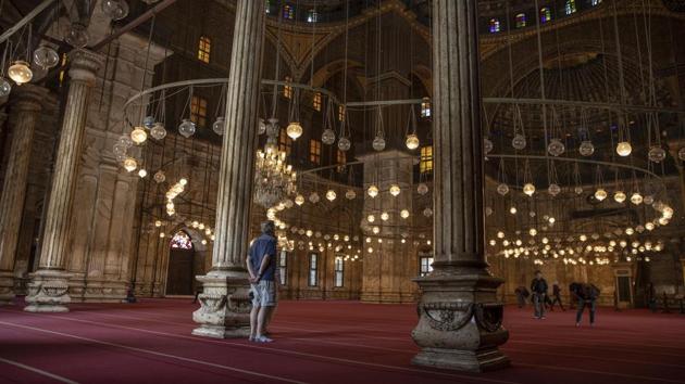 A view inside the Mosque of Muhammad Ali Pasha at the Citadel complex. Cairo’s busy thoroughfares remain silenced under curfew, but the country has for now backed off from implementing a full lockdown for fear of leaving the day-workers that fuel its informal economy without income. (Nariman El-Mofty / AP) A view inside the Mosque of Muhammad Ali Pasha at the Citadel complex. Cairo’s busy thoroughfares remain silenced under curfew, but the country has for now backed off from implementing a full lockdown for fear of leaving the day-workers that fuel its informal economy without income. (Nariman El-Mofty / AP)