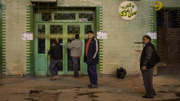 Cafe owners close their shop after restrictions are imposed at night hours. Abdel Karim Sayed, a coffee shop owner in Cairo, said he has placed half of his employees on furlough, and cut the others’ wages by a third.“We are all financially ruined,” he said to AP. (Nariman El-Mofty / AP) Cafe owners close their shop after restrictions are imposed at night hours. Abdel Karim Sayed, a coffee shop owner in Cairo, said he has placed half of his employees on furlough, and cut the others’ wages by a third.“We are all financially ruined,” he said to AP. (Nariman El-Mofty / AP)