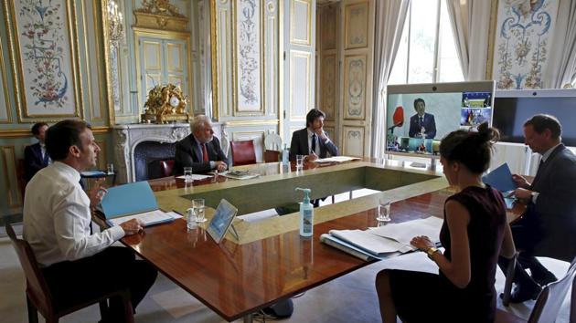 French President Emmanuel Macron, left, gestures as he speaks during a videoconference on the conoravirus with Group of Seven leaders at the Elysee Palace in Paris. (AP) French President Emmanuel Macron, left, gestures as he speaks during a videoconference on the conoravirus with Group of Seven leaders at the Elysee Palace in Paris. (AP)