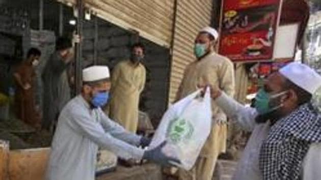 Pakistan till now has reported a total of 6,506 confirmed cases of coronavirus with 123 deaths, the paper reported.(AP file photo) Pakistan till now has reported a total of 6,506 confirmed cases of coronavirus with 123 deaths, the paper reported.(AP file photo)