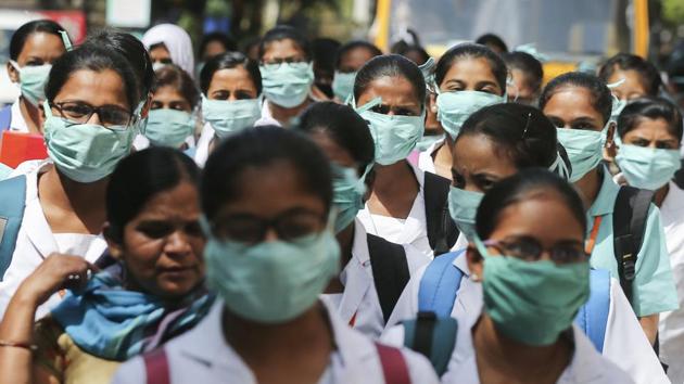 Covid-19 update: Indian nursing students wearing masks walk in a group at government run Gandhi Hospital in Hyderabad, India. (AP) Covid-19 update: Indian nursing students wearing masks walk in a group at government run Gandhi Hospital in Hyderabad, India. (AP)