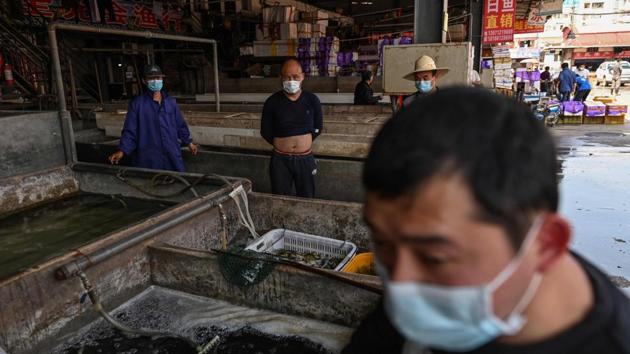 The Wuhan market shut  in January and the Chinese authorities enforced a temporary ban on all wildlife trade. While that ban still holds, the wet markets have now opened for business.  (Hector RETAMAL / AFP) 