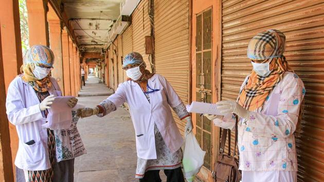 Medical professionals studying their report after a door-to-door examination of COVID-19 during a nationwide lockdown imposed in the wake of coronavirus pandemic, in Jaipur, Saturday, April 11, 2020. (PTI) Medical professionals studying their report after a door-to-door examination of COVID-19 during a nationwide lockdown imposed in the wake of coronavirus pandemic, in Jaipur, Saturday, April 11, 2020. (PTI)