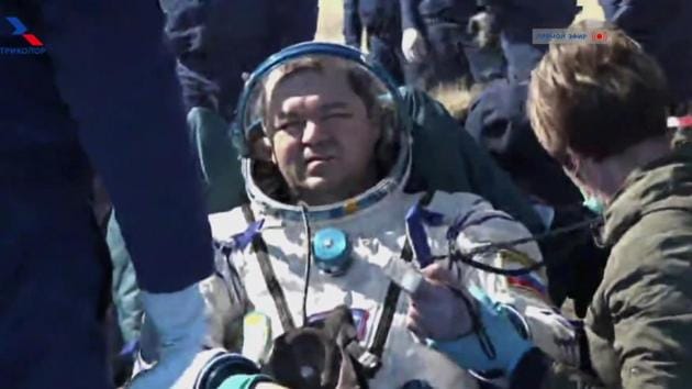 Russian cosmonaut Oleg Skripochka sits in a chair shortly after the landing of the Russian Soyuz MS-15 space capsule near the town of Dzhezkazgan, Kazakhstan on April 17, 2020. (AP) Russian cosmonaut Oleg Skripochka sits in a chair shortly after the landing of the Russian Soyuz MS-15 space capsule near the town of Dzhezkazgan, Kazakhstan on April 17, 2020. (AP)