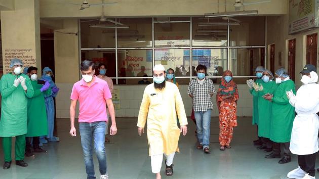 Seven patients who recovered from Covid-19 leave after being discharged from a hospital in Indore on April 12. (ANI Photo) Seven patients who recovered from Covid-19 leave after being discharged from a hospital in Indore on April 12. (ANI Photo)