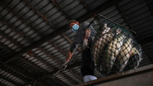 Vendors at Wuhan’s markets say unaffordable rents and the lingering effects of the citywide shutdown are more immediate concerns than the threat of contagion, as reported by AFP. (Hector RETAMAL / AFP) 