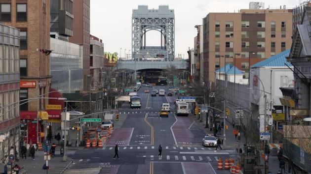 There is little traffic on 125th Street, Thursday, April 16, 2020, in the Harlem neighborhood of New York during the coronavirus pandemic. Gov. Andrew Cuomo extended stay-at-home restrictions Thursday through mid-May. (AP Photo/Mark Lennihan) (AP)