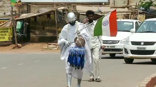 Mohan Mohapatra dresses up as Mahatma Gandhi in Bhubaneshwar, Odisha,