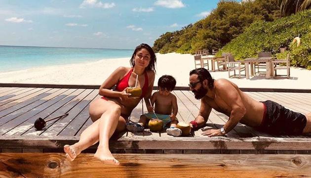 Kareena Kapoor Khan shared her beach vacation picture with hubby Saif Ali Khan and son Taimur and captioned it, “I am not dreaming of beaches... You are!#TakeMeBack.”(Instagram)