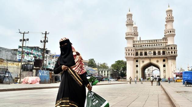 A woman walks past the Charminar during the lockdown amid Covid-19 pandemic, in Hyderabad.(ANI File)