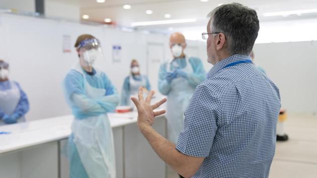 The new advice says that when gowns run out alternative options include using a plastic apron, borrowing supplies from other hospitals, or wearing coveralls, the Guardian reported. (AP photo. Representative image) The new advice says that when gowns run out alternative options include using a plastic apron, borrowing supplies from other hospitals, or wearing coveralls, the Guardian reported. (AP photo. Representative image)