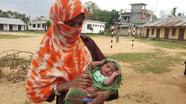 Migrant vendor Manju Bauri holds her newborn baby boy, who was born during the Covid-19 lockdown in Tripura’s Agartala. (HT Photo) Migrant vendor Manju Bauri holds her newborn baby boy, who was born during the Covid-19 lockdown in Tripura’s Agartala. (HT Photo)
