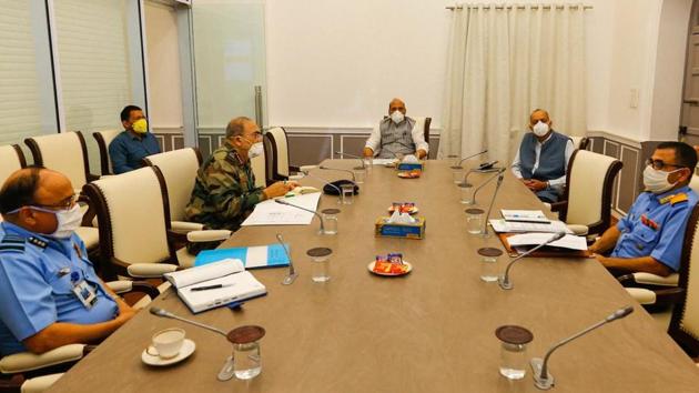 Defence Minister Rajnath Singh, wearing face mask, holds a meeting to review the functioning of Armed Forces Medical Services (AFMS) and their assistance to civilian authorities in containing spread of COVID-19 pandemic. (PTI) Defence Minister Rajnath Singh, wearing face mask, holds a meeting to review the functioning of Armed Forces Medical Services (AFMS) and their assistance to civilian authorities in containing spread of COVID-19 pandemic. (PTI)