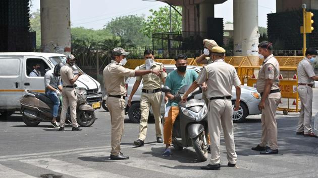 Police personnel screen vehicles for identity cards during the lockdown, at IP Extension in New Delhi. (Sushil Kumar/HT PHOTO) Police personnel screen vehicles for identity cards during the lockdown, at IP Extension in New Delhi. (Sushil Kumar/HT PHOTO)