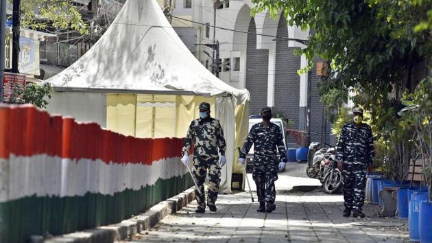 Paramilitary personnel seen at the cordoned off entry route to the Tablighi Jamaat's Alami Markaz Banglewali Masjid building in Nizamuddin, New Delhi, India, on Monday, April 13, 2020.(Sanjeev Verma/HT PHOTO)