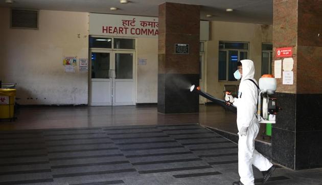 A worker in a protective suit sprays disinfectant during sanitization to check the spread of coronavirus, at Safderjung Hospital in New Delhi, India, on Monday, March 30, 2020. (Vipin Kumar/HT PHOTO) A worker in a protective suit sprays disinfectant during sanitization to check the spread of coronavirus, at Safderjung Hospital in New Delhi, India, on Monday, March 30, 2020. (Vipin Kumar/HT PHOTO)