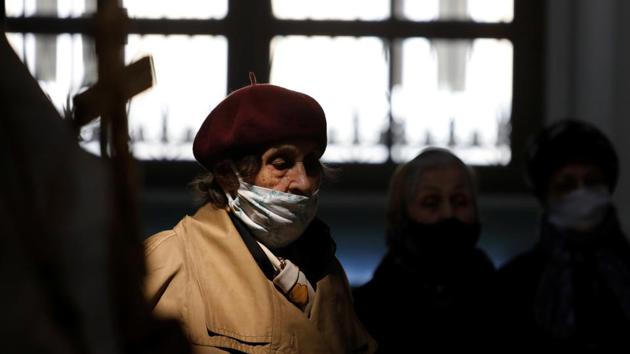 A woman wearing a protective face mask prays during a service at the cathedral on the eve of the Orthodox Easter, amid the coronavirus disease (Covid-19) outbreak in Stavropol, Russia on  April 18, 2020. (Reuters file photo)