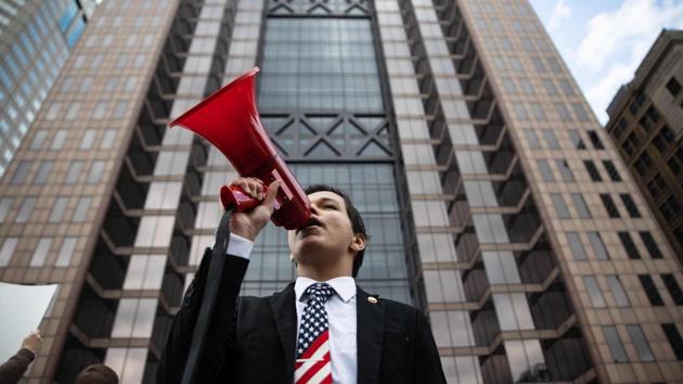 A protester yells into a megaphone at a rally at the Ohio State House in Columbus, Ohio on April 18, 2020, to protest the stay home order that is in effect until May 1st. (AFP) A protester yells into a megaphone at a rally at the Ohio State House in Columbus, Ohio on April 18, 2020, to protest the stay home order that is in effect until May 1st. (AFP)