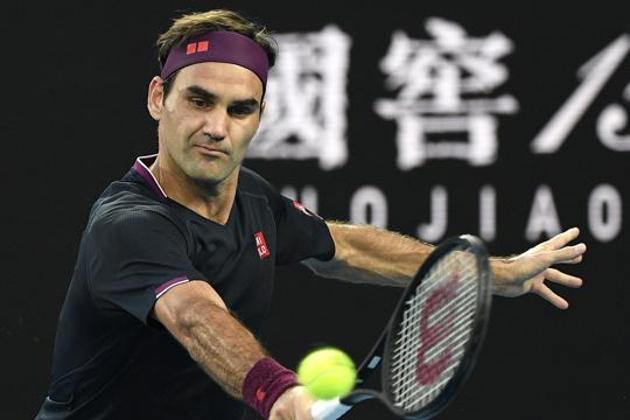 FILE - In this Thursday, Jan. 30, 2020 file photo, Switzerland's Roger Federer makes a backhand return to Serbia's Novak Djokovic during their semifinal match at the Australian Open tennis championship in Melbourne, Australia. (AP) FILE - In this Thursday, Jan. 30, 2020 file photo, Switzerland's Roger Federer makes a backhand return to Serbia's Novak Djokovic during their semifinal match at the Australian Open tennis championship in Melbourne, Australia. (AP)