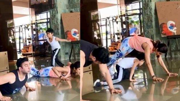Shilpa Shetty’s son Viaan plays around his parents as they workout at home. Shilpa Shetty’s son Viaan plays around his parents as they workout at home.