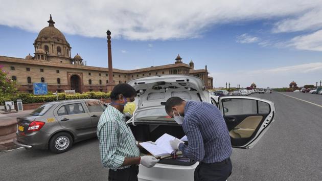 Government employees seen outside North Block as ministries and government offices partially resume working from offices, at Raisina Hills, in New Delhi, India, on Monday, April 20, 2020. (Burhaan Kinu/HT PHOTO) Government employees seen outside North Block as ministries and government offices partially resume working from offices, at Raisina Hills, in New Delhi, India, on Monday, April 20, 2020. (Burhaan Kinu/HT PHOTO)