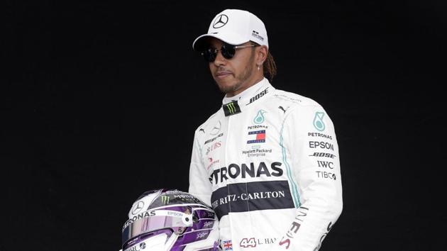 Mercedes driver Lewis Hamilton of Britain poses for a photo at the Australian Formula One Grand Prix in Melbourne, Thursday, March 12, 2020. (AP) Mercedes driver Lewis Hamilton of Britain poses for a photo at the Australian Formula One Grand Prix in Melbourne, Thursday, March 12, 2020. (AP)