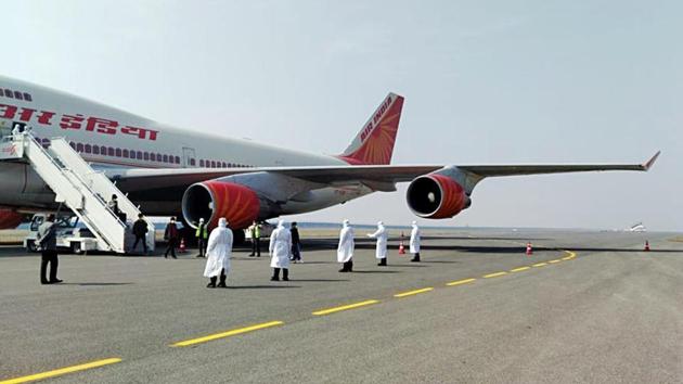 Medical officials during the screening of 323 Indians and 7 Maldives citizens, that took off from the coronavirus outbreak city Wuhan (China) in Air India special flight and landed at Delhi airport, on February 2, 2020. (ANI) Medical officials during the screening of 323 Indians and 7 Maldives citizens, that took off from the coronavirus outbreak city Wuhan (China) in Air India special flight and landed at Delhi airport, on February 2, 2020. (ANI)