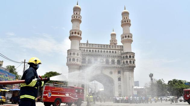 A Telangana Fire Service personnel disinfects area near Charminar in Hyderabad to prevent the spread of coronavirus. (ANI) A Telangana Fire Service personnel disinfects area near Charminar in Hyderabad to prevent the spread of coronavirus. (ANI)